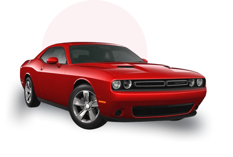 A vibrant red Dodge Challenger in front of a large red circle, showcasing its sleek design and sporty appearance.