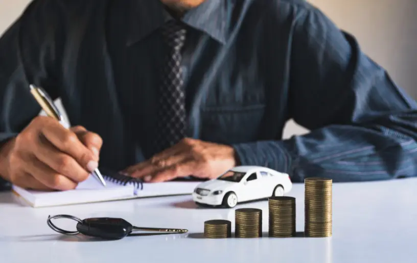 a man looking at car loan terms and ammortization schedule in canada